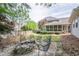 Large backyard with a fire pit and chairs, perfect for outdoor entertaining at 1655 Holly Lake Cir, Snellville, GA 30078