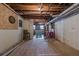 Unfinished basement with exposed ductwork, open ceiling, and concrete flooring at 1655 Holly Lake Cir, Snellville, GA 30078