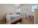 Charming bedroom featuring plush carpet, a queen bed, and natural light at 1655 Holly Lake Cir, Snellville, GA 30078