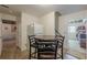 Dining area featuring a table with chairs next to the kitchen, with white appliances at 1655 Holly Lake Cir, Snellville, GA 30078