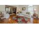 Bright living room with hardwood floors, large windows, and stylish furniture at 1655 Holly Lake Cir, Snellville, GA 30078