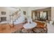 Comfortable living room area showcasing hardwood floors, staircase, and open floor plan at 1655 Holly Lake Cir, Snellville, GA 30078