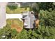 Aerial view of a well-maintained home with a spacious backyard surrounded by mature trees at 2875 Riverbend Ct, Snellville, GA 30078