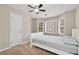 Bedroom featuring multiple windows, ceiling fan and neutral walls at 2875 Riverbend Ct, Snellville, GA 30078
