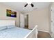 Bedroom with blue bedspread, neutral walls, and ceiling fan at 2875 Riverbend Ct, Snellville, GA 30078
