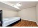 Simple bedroom with wood flooring and a basic bed frame providing a comfortable space at 2875 Riverbend Ct, Snellville, GA 30078