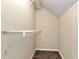 Walk-in closet with shelves and carpeted floor at 2875 Riverbend Ct, Snellville, GA 30078
