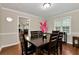 Dining room features hardwood floors and a view of the living room at 2875 Riverbend Ct, Snellville, GA 30078