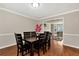 Dining room with hardwood floors and seating for six at 2875 Riverbend Ct, Snellville, GA 30078