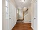 Bright foyer with wood-look floors and staircase at 2875 Riverbend Ct, Snellville, GA 30078