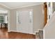Bright foyer with wood-look floors and staircase at 2875 Riverbend Ct, Snellville, GA 30078
