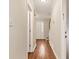 Well-lit hallway with hardwood floors and neutral paint at 2875 Riverbend Ct, Snellville, GA 30078