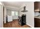 Modern kitchen features hardwood floors, stainless steel appliances, and access to backyard at 2875 Riverbend Ct, Snellville, GA 30078