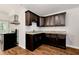 Kitchen boasts granite countertops, stainless steel appliances, and dark wood cabinets at 2875 Riverbend Ct, Snellville, GA 30078