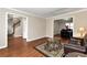 Spacious living room featuring hardwood floors and open access to the staircase at 2875 Riverbend Ct, Snellville, GA 30078