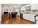 Open concept with kitchen, dining, and living areas all flowing together with hardwood flooring at 2875 Riverbend Ct, Snellville, GA 30078