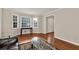 Bright living room with large windows and hardwood floors at 2875 Riverbend Ct, Snellville, GA 30078