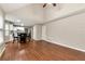 Bright living room with hardwood floors, many windows, and an open floorplan leading to kitchen at 2875 Riverbend Ct, Snellville, GA 30078