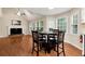 Bright living room with hardwood floors, fireplace, and an open floorplan leading to kitchen at 2875 Riverbend Ct, Snellville, GA 30078