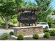 The community sign reads: Summit Chase, set amidst lush greenery at 2875 Riverbend Ct, Snellville, GA 30078