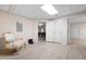 Basement area featuring a chair and a view into an adjacent room with a pool table at 3053 Lawson Dr, Marietta, GA 30064