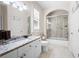 Bright bathroom with a granite countertop vanity, tub-shower combo, and plantation shutters at 3053 Lawson Dr, Marietta, GA 30064