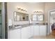 Bathroom boasts granite countertop, double sinks, modern lighting, and a tile floor at 3053 Lawson Dr, Marietta, GA 30064