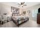 Cozy bedroom with a ceiling fan, a map decor, and bright window with wooden floors at 3053 Lawson Dr, Marietta, GA 30064