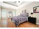 Bedroom features natural light, wood floors, and a trey ceiling at 3053 Lawson Dr, Marietta, GA 30064
