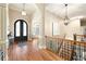 Grand foyer boasts hardwood floors, arched doorway, and elegant staircase at 3053 Lawson Dr, Marietta, GA 30064