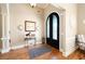 Elegant foyer with hardwood floors, arched doorway, and decorative accents at 3053 Lawson Dr, Marietta, GA 30064