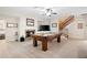 Spacious game room with a fireplace, a pool table, and hardwood-style floors at 3053 Lawson Dr, Marietta, GA 30064