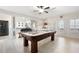 Spacious game room with a pool table, wet bar, and hardwood-style floors at 3053 Lawson Dr, Marietta, GA 30064