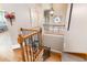 Hall staircase features wood steps, iron railings, and decorative artwork on the walls at 3053 Lawson Dr, Marietta, GA 30064