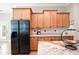 Spacious kitchen features stainless steel appliances, granite countertops, wooden cabinetry, and hardwood flooring at 3053 Lawson Dr, Marietta, GA 30064
