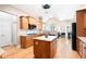 Open-concept kitchen with granite countertops, stainless steel appliances, a center island, and hardwood floors at 3053 Lawson Dr, Marietta, GA 30064