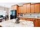 Elegant kitchen with stainless steel appliances, granite countertops, wood cabinets, and an adjacent dining area at 3053 Lawson Dr, Marietta, GA 30064