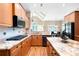 Well-appointed kitchen featuring granite countertops, stainless steel appliances, hardwood floors, and breakfast area at 3053 Lawson Dr, Marietta, GA 30064