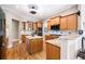 Gourmet kitchen boasts granite countertops, stainless steel appliances, wood cabinets, and hardwood floors at 3053 Lawson Dr, Marietta, GA 30064