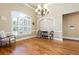 Spacious living room with hardwood floors, plantation shutters, and elegant lighting at 3053 Lawson Dr, Marietta, GA 30064