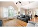 Comfortable living room featuring hardwood floors, plantation shutters, and modern furnishings at 3053 Lawson Dr, Marietta, GA 30064