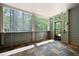 Screened porch with slate flooring and a view of the surrounding woods at 3053 Lawson Dr, Marietta, GA 30064