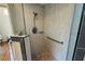 Modern tile shower features a glass door, showerhead, and built-in seat at 3053 Lawson Dr, Marietta, GA 30064