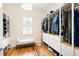 Spacious walk-in closet featuring custom shelving, drawers, and a bench, providing ample storage and organization at 3053 Lawson Dr, Marietta, GA 30064