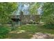 The backyard features a brick home exterior and a spacious yard, offering privacy and potential for outdoor activities at 3139 Mary Dr, Marietta, GA 30066