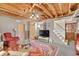 Finished basement with exposed ceiling, stairway, sitting area, and TV at 3139 Mary Dr, Marietta, GA 30066