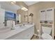 Bright bathroom featuring white cabinets, vanity, and a modern toilet at 3139 Mary Dr, Marietta, GA 30066