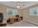Bedroom with windows, carpet floors, ceiling fan, and desk with computer at 3139 Mary Dr, Marietta, GA 30066