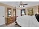 Bedroom featuring a four-poster bed, dark curtains, and vintage-style furniture at 3139 Mary Dr, Marietta, GA 30066