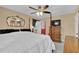 Bedroom with four-poster bed, decorative mirror, and light-colored walls at 3139 Mary Dr, Marietta, GA 30066